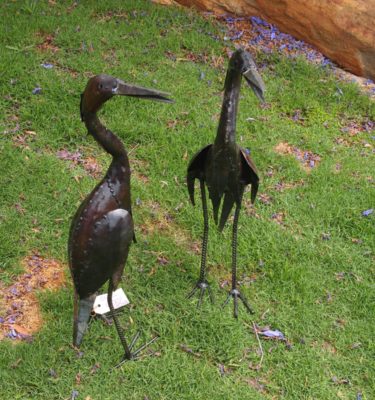 The elegant large Brolga (Australian Crane) stand on legs made from Concrete reinforcement bars. The sleek shape and main body of the sculpture is made from Recycled Oil drums giving the Brolgas a rustic edge making a beautiful Garden Feature. The Brolga Garden Ornaments are perfect for patios, Lawns and decking. The large Brolga is approximately 110cm and the small Brolga is approximately 62cm.